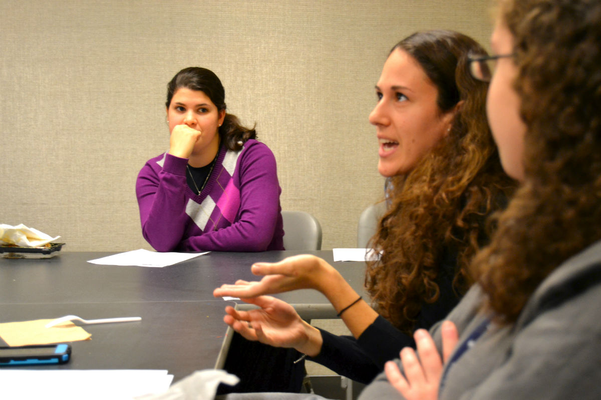 Students weigh in on a topic at Lander College for Women\'s extracurricular Torah Learning Club. 