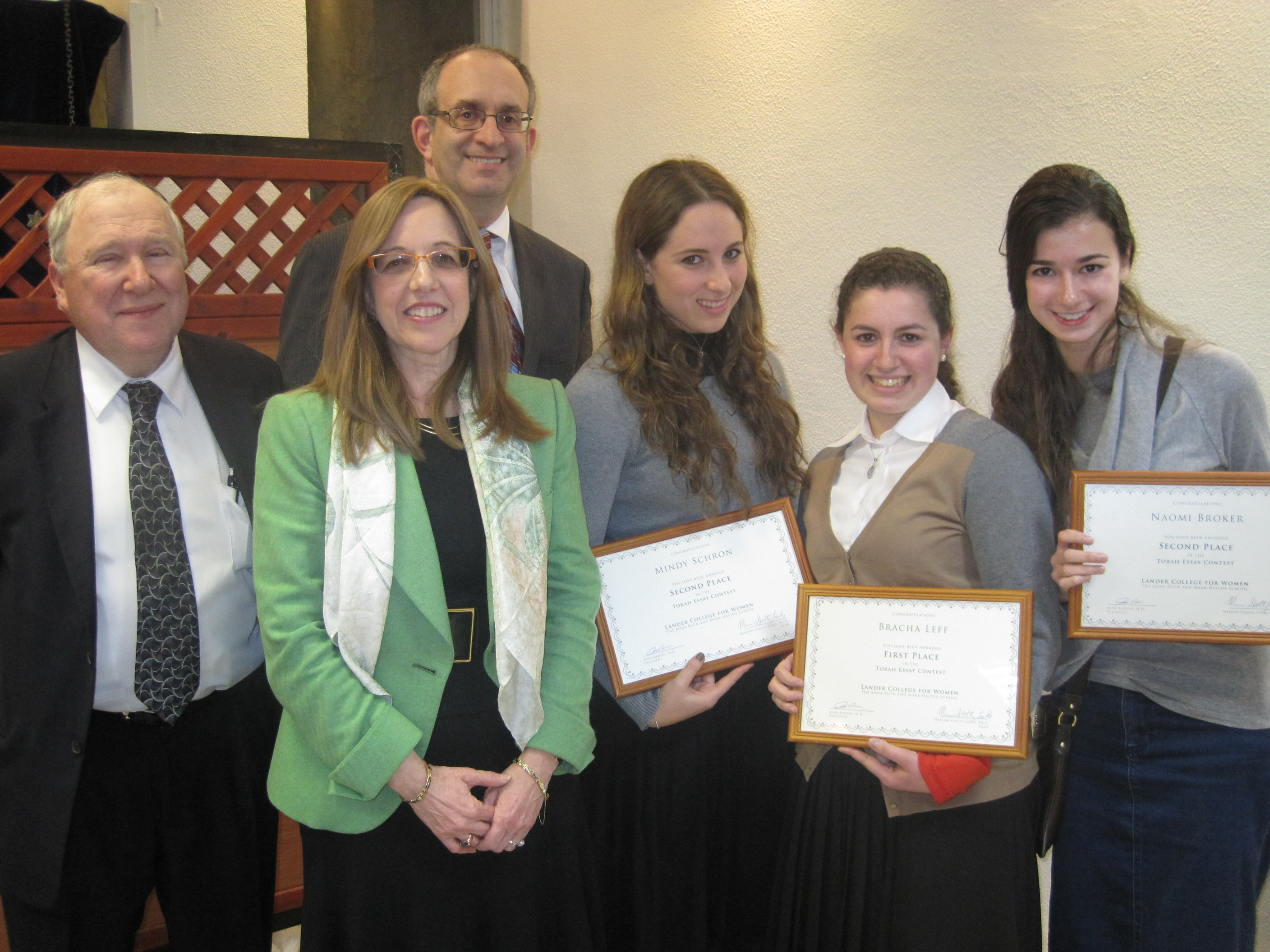 Pictured from left to right: Dr. David Luchins, founding dean and chair of the political science department; Marian Stoltz-Loike dean and Touro’s vice president of online education; Dr. Alan Kadish, president and CEO of the Touro College and University System; second-place winner Mindy S.; first-place winner Bracha L.; and second-place winner Naomi B.