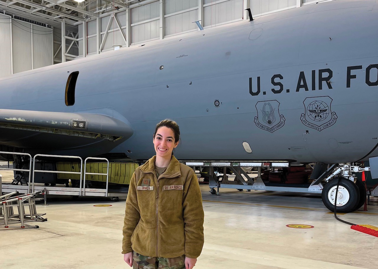 Rena Winick in uniform in front of an Air Force plane