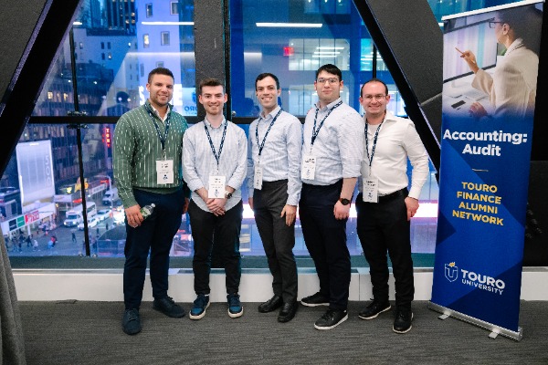 Five students from the Touro Finance Alumni Network pose at the annual event.