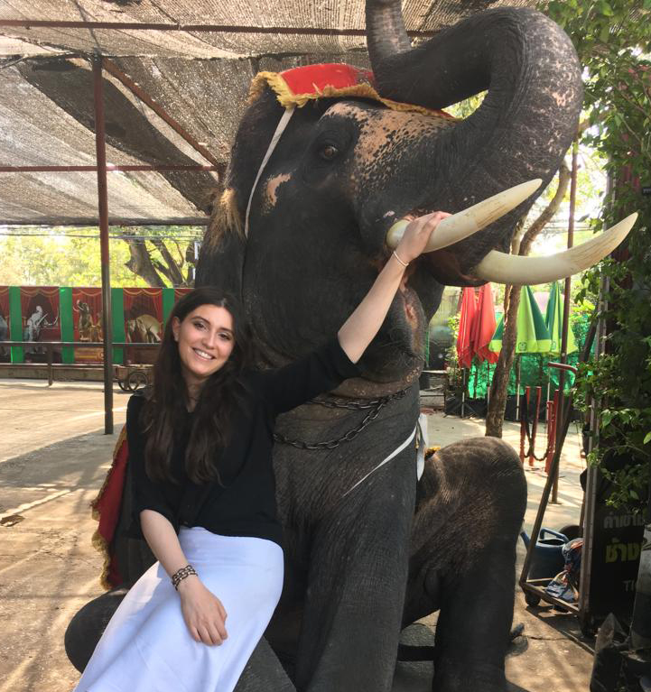 Shanie Sebbag posing with an elephant in Thailand